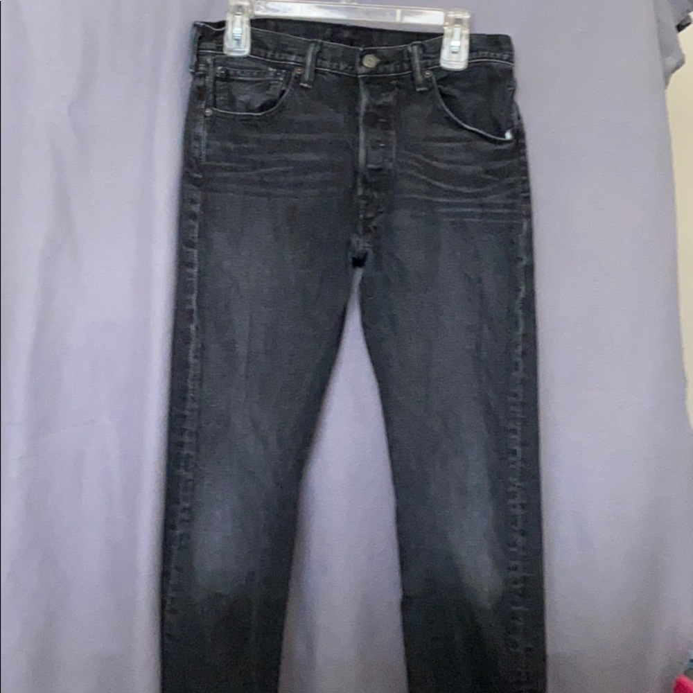 Men’s black, button fly faded jeans. Size 32x34